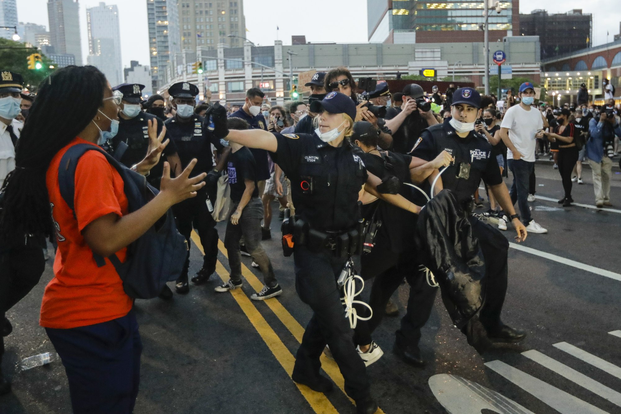 officer warns a protester during an arrest at a rally Friday, May 29 ...